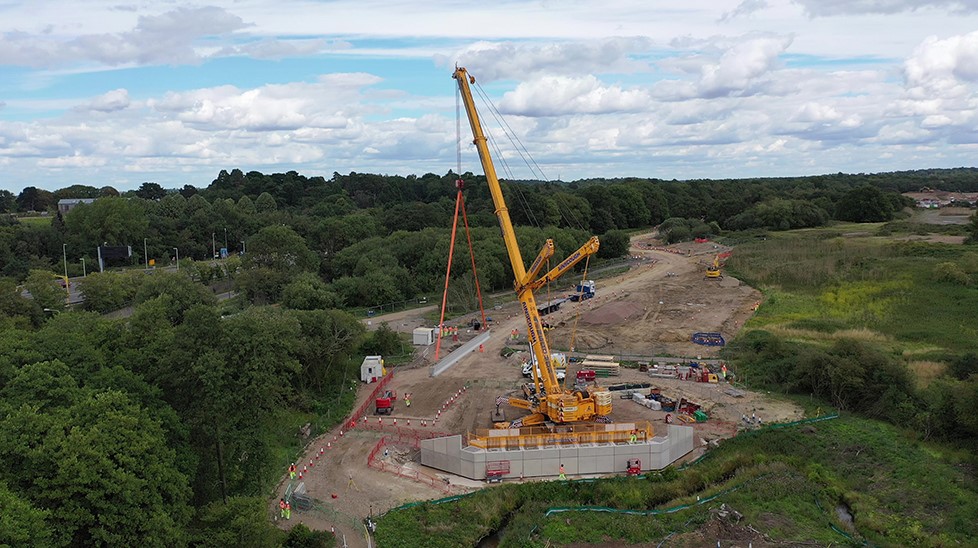 Bridge beam installation on shell abutments on M25 Stratford Brook, United Kingdom